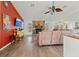Spacious living room with stone fireplace and hardwood floors at 13101 Delbarton St, Spring Hill, FL 34609