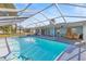 Inviting screened pool with patio and seating area at 13101 Delbarton St, Spring Hill, FL 34609