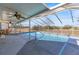 Screened pool with patio furniture and large backyard at 13101 Delbarton St, Spring Hill, FL 34609