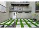 Private backyard oasis with artificial turf and patio at 162 E Davis Blvd, Tampa, FL 33606