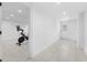 Basement hallway with tile flooring and access to the home gym at 162 E Davis Blvd, Tampa, FL 33606