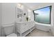 Spa-like bathroom featuring a soaking tub and double vanity at 162 E Davis Blvd, Tampa, FL 33606