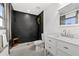 Modern bathroom with dark slate tile shower and white vanity at 162 E Davis Blvd, Tampa, FL 33606