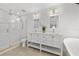 Elegant bathroom with double vanity, soaking tub, and walk-in shower at 162 E Davis Blvd, Tampa, FL 33606