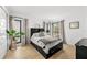 Well-lit bedroom with a queen-size bed and stylish decor at 162 E Davis Blvd, Tampa, FL 33606
