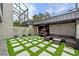 Relaxing courtyard with artificial turf, seating, and golf cart at 162 E Davis Blvd, Tampa, FL 33606