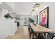 Open concept dining area with long live-edge table and modern chairs at 162 E Davis Blvd, Tampa, FL 33606