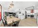 Kitchen and dining area with long live-edge table and industrial chairs at 162 E Davis Blvd, Tampa, FL 33606