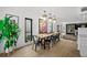 Bright dining room with a long wooden table and metal chairs at 162 E Davis Blvd, Tampa, FL 33606