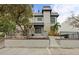 Contemporary townhouse with gray facade, steps, and landscaping at 162 E Davis Blvd, Tampa, FL 33606