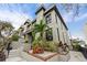 Stylish townhouse with gray exterior, landscaping, and brick accents at 162 E Davis Blvd, Tampa, FL 33606