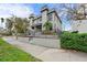 Gray two-story townhouse with modern design, steps, and landscaping at 162 E Davis Blvd, Tampa, FL 33606