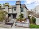 Gray two-story home with landscaped front yard and black metal fence at 162 E Davis Blvd, Tampa, FL 33606
