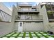 Rear exterior view showing two-story building with patio at 162 E Davis Blvd, Tampa, FL 33606
