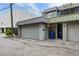 Attached garage with a light gray door at 162 E Davis Blvd, Tampa, FL 33606