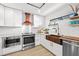 Updated kitchen with copper farmhouse sink and stainless steel appliances at 162 E Davis Blvd, Tampa, FL 33606