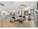 Open concept living room with sectional sofa, ottoman and upper level view at 162 E Davis Blvd, Tampa, FL 33606