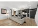 Spacious living area with light sofa, hardwood floors, and fireplace at 162 E Davis Blvd, Tampa, FL 33606