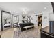 Spacious main bedroom with large mirror, chandelier, and walk-in closet at 162 E Davis Blvd, Tampa, FL 33606