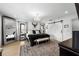 Elegant main bedroom with a comfortable king-size bed and large mirror at 162 E Davis Blvd, Tampa, FL 33606
