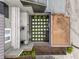 Private patio with a tiled surface and artificial turf at 162 E Davis Blvd, Tampa, FL 33606