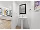 Stylish powder room with pedestal sink and contemporary design at 162 E Davis Blvd, Tampa, FL 33606