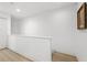 Modern staircase with light-colored wood floors and white walls at 162 E Davis Blvd, Tampa, FL 33606
