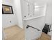 Stylish staircase leading to upper level; light wood floors and white walls at 162 E Davis Blvd, Tampa, FL 33606