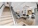Modern staircase with metal railing leading to the upper level at 162 E Davis Blvd, Tampa, FL 33606