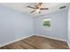 Light and airy bedroom with wood-look floors and a window at 1654 50Th N Ave, St Petersburg, FL 33714