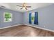 Spacious bedroom with light blue walls and wood-look floors at 1654 50Th N Ave, St Petersburg, FL 33714