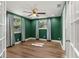 Well-lit bedroom with hardwood floors and green walls at 1654 50Th N Ave, St Petersburg, FL 33714