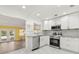 Modern kitchen with stainless steel appliances and white cabinets at 1654 50Th N Ave, St Petersburg, FL 33714