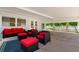 Covered patio with comfortable wicker furniture at 1654 50Th N Ave, St Petersburg, FL 33714