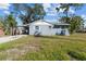 Side view of a single-story home at 1701 Mississippi Ne Ave, St Petersburg, FL 33703