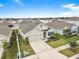Aerial view of a house with a landscaped yard at 17019 Avon Dive Ln, Wimauma, FL 33598