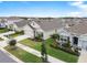 Aerial view of a charming house and neighborhood at 17019 Avon Dive Ln, Wimauma, FL 33598