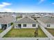 Aerial view of a house with backyard, surrounded by other houses at 17019 Avon Dive Ln, Wimauma, FL 33598