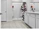 Clean bathroom with shower and double vanity at 17019 Avon Dive Ln, Wimauma, FL 33598