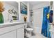 Clean bathroom with white vanity and blue accents at 17019 Avon Dive Ln, Wimauma, FL 33598