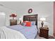 Comfortable bedroom with a large bed and en-suite bathroom at 17019 Avon Dive Ln, Wimauma, FL 33598