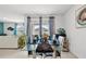 Dining area with glass table and backyard view at 17019 Avon Dive Ln, Wimauma, FL 33598