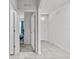 Bright hallway with tile floors leading to other rooms at 17019 Avon Dive Ln, Wimauma, FL 33598