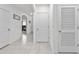 Clean hallway with tile floors and neutral colors at 17019 Avon Dive Ln, Wimauma, FL 33598