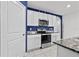 Kitchen with white cabinets and stainless steel appliances at 17019 Avon Dive Ln, Wimauma, FL 33598