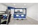 Modern kitchen with blue island and breakfast bar at 17019 Avon Dive Ln, Wimauma, FL 33598