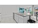 Kitchen island with granite countertop and sink at 17019 Avon Dive Ln, Wimauma, FL 33598