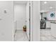 Laundry room with washer, dryer, and kitchen view at 17019 Avon Dive Ln, Wimauma, FL 33598