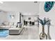 Open living room and kitchen area with tile floors at 17019 Avon Dive Ln, Wimauma, FL 33598