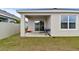 Covered patio with a grill and a small cooler at 17019 Avon Dive Ln, Wimauma, FL 33598